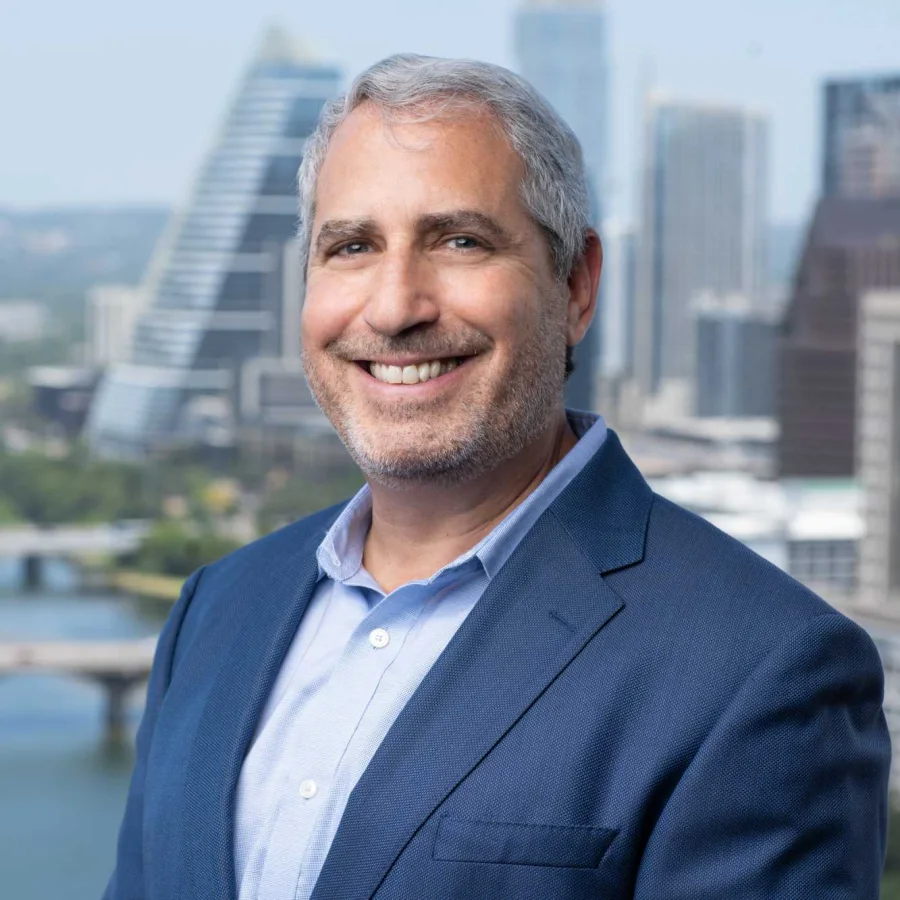 Rich Edison in front of the Austin skyline